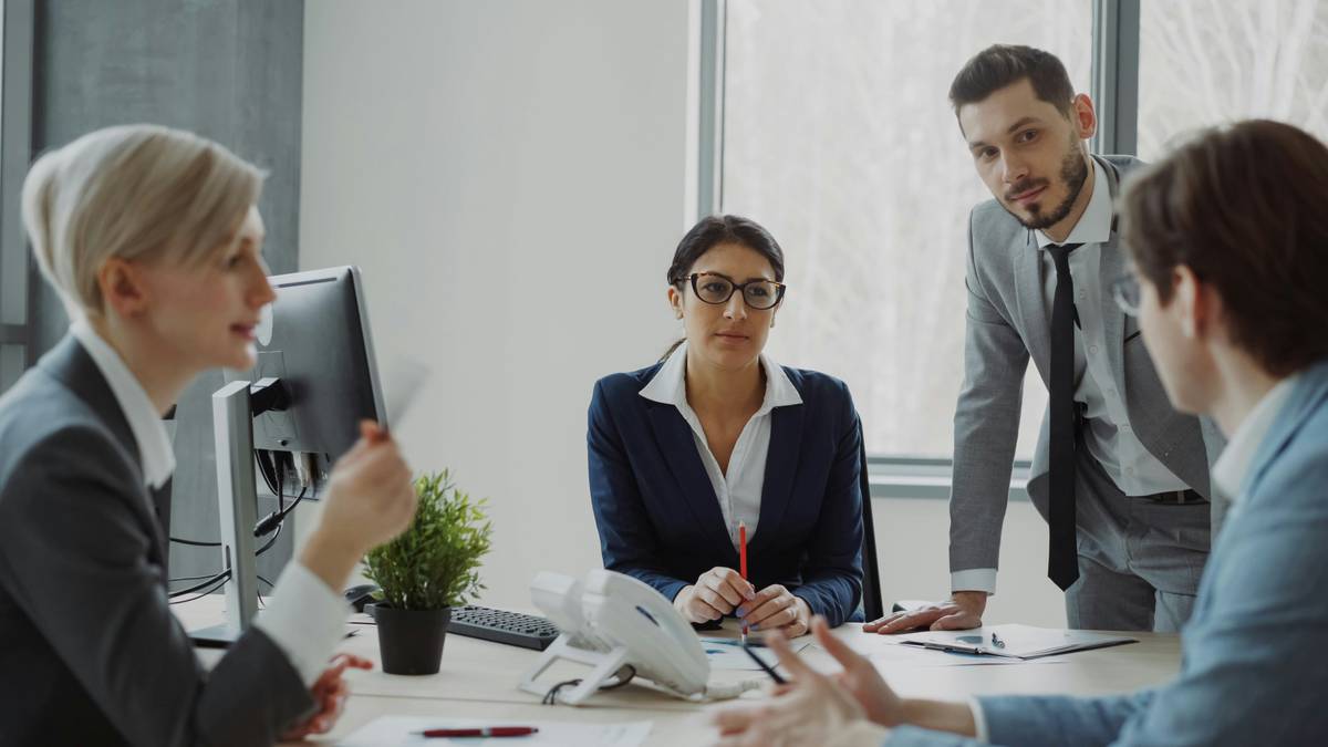 A professional reviewing a financial planning association membership dashboard with data visualizations, including compliance alerts and CEU tracker — financial planning association
